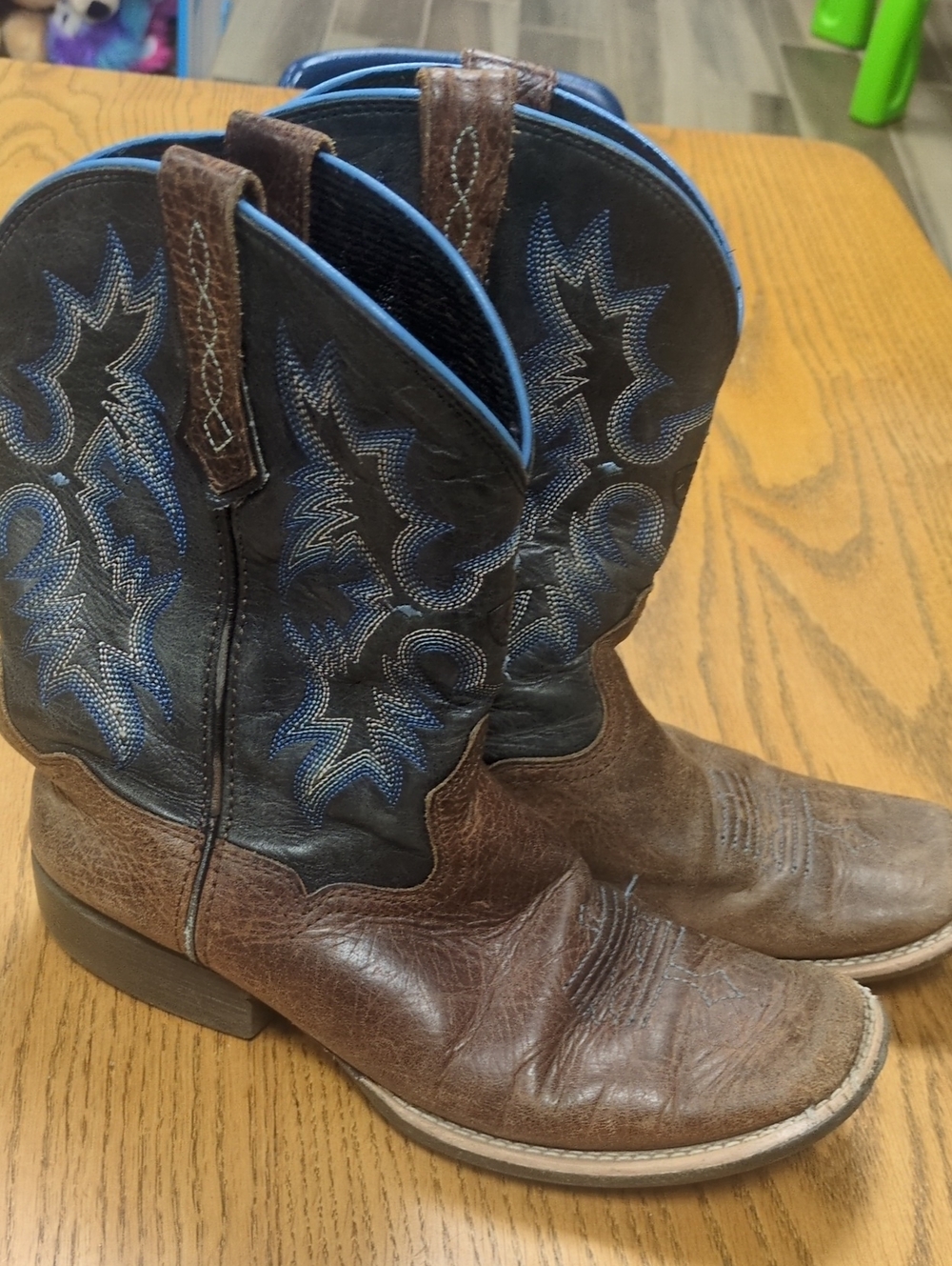 Ariat Brown and Black Kids Cowboy Boots with Blue Stitching